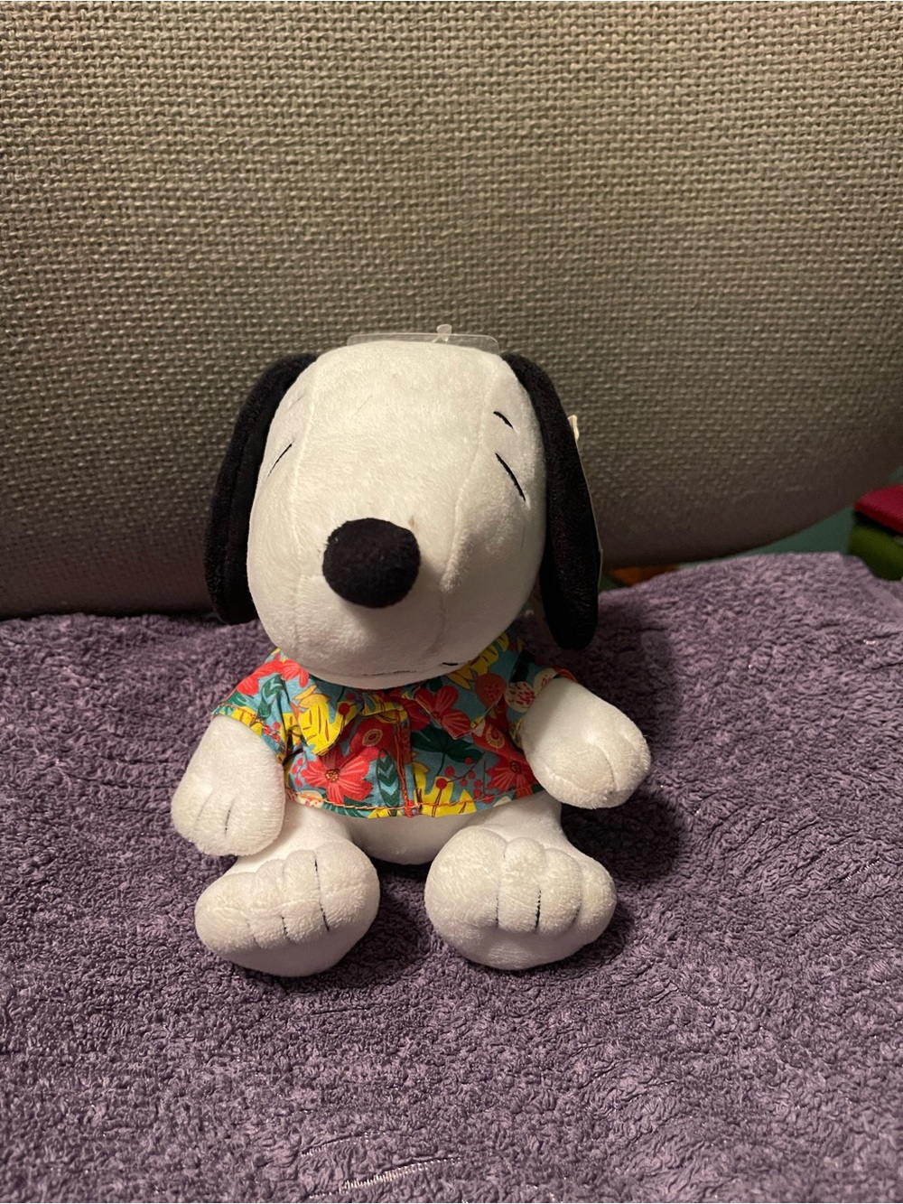 Peanuts Snoopy Plush Toy in White with Black Ears and Colorful Floral Shirt